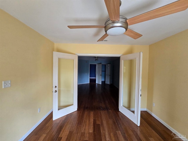 unfurnished room featuring dark hardwood / wood-style floors and french doors