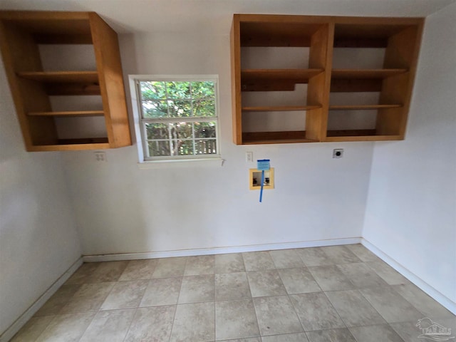 clothes washing area featuring hookup for an electric dryer and washer hookup