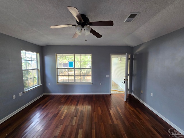 unfurnished room featuring a textured ceiling, dark hardwood / wood-style flooring, ceiling fan, and lofted ceiling