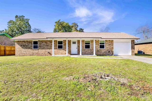 ranch-style home with a garage, brick siding, fence, concrete driveway, and a front lawn