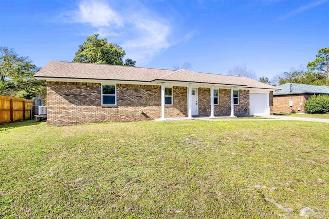 single story home featuring a garage, driveway, brick siding, fence, and a front yard