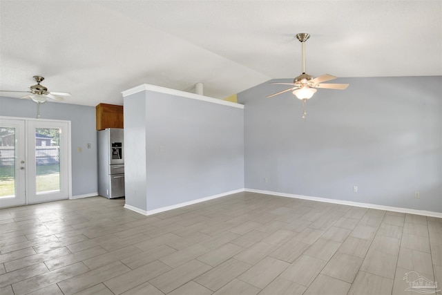 interior space featuring lofted ceiling, baseboards, a ceiling fan, and french doors