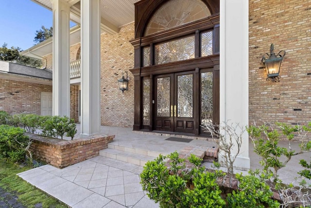 721 W Miracle Strip Pkwy, Mary Esther, FL 32569 - doorway to property with brick siding and covered porch