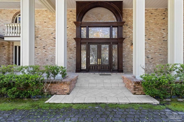 721 W Miracle Strip Pkwy, Mary Esther, FL 32569 - doorway to property featuring brick siding and covered porch