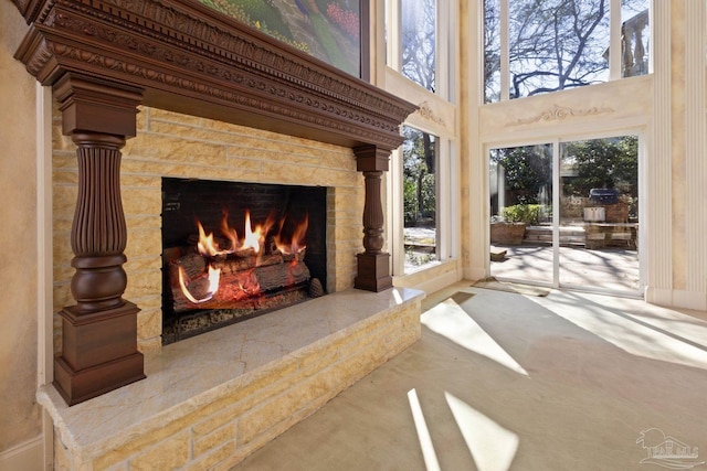 721 W Miracle Strip Pkwy, Mary Esther, FL 32569 - room details featuring a stone fireplace and carpet flooring