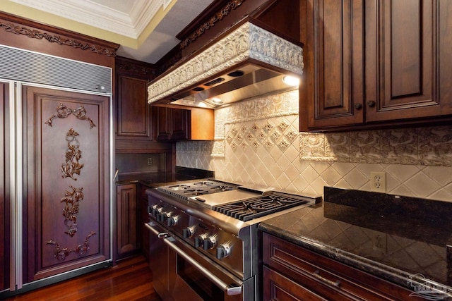 721 W Miracle Strip Pkwy, Mary Esther, FL 32569 - kitchen featuring double oven range, ornamental molding, decorative backsplash, dark wood-type flooring, and wall chimney exhaust hood