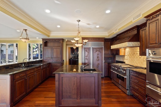 721 W Miracle Strip Pkwy, Mary Esther, FL 32569 - kitchen with dark wood finished floors, high quality appliances, a warming drawer, and a sink