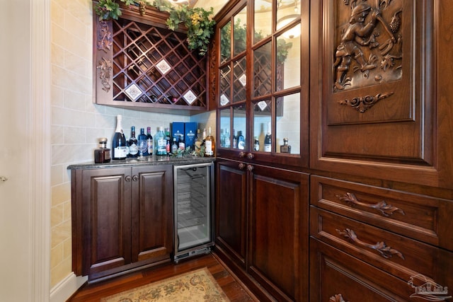 721 W Miracle Strip Pkwy, Mary Esther, FL 32569 - bar with wine cooler, a bar, and dark wood-style flooring