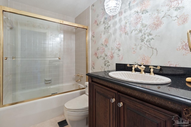 721 W Miracle Strip Pkwy, Mary Esther, FL 32569 - full bathroom featuring enclosed tub / shower combo, toilet, vanity, and wallpapered walls
