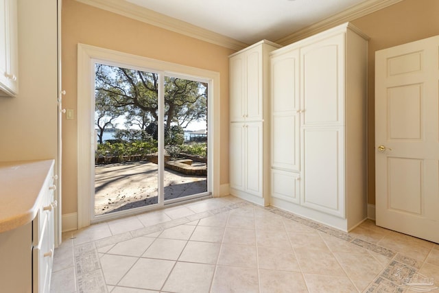 721 W Miracle Strip Pkwy, Mary Esther, FL 32569 - entryway featuring light tile patterned floors, baseboards, and ornamental molding