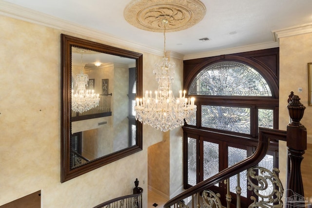 721 W Miracle Strip Pkwy, Mary Esther, FL 32569 - staircase with visible vents, crown molding, a high ceiling, and an inviting chandelier