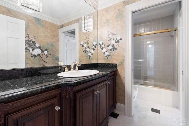 721 W Miracle Strip Pkwy, Mary Esther, FL 32569 - bathroom featuring enclosed tub / shower combo, vanity, toilet, and crown molding
