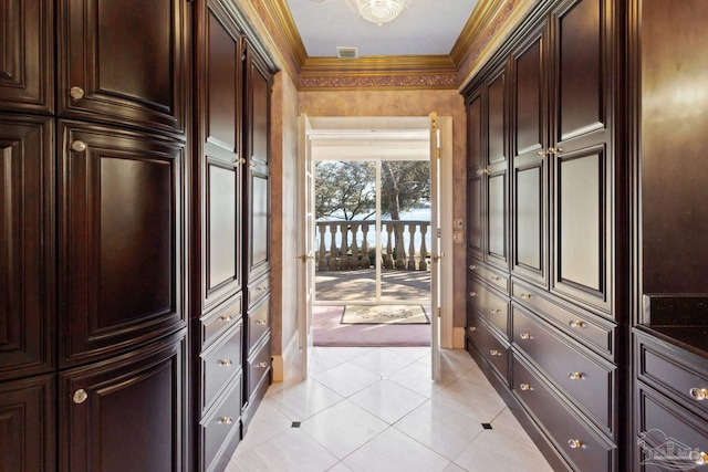 721 W Miracle Strip Pkwy, Mary Esther, FL 32569 - doorway featuring light tile patterned floors, visible vents, and ornamental molding