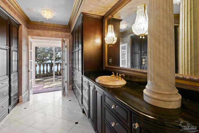 721 W Miracle Strip Pkwy, Mary Esther, FL 32569 - bathroom with vanity, a chandelier, tile patterned flooring, and ornamental molding