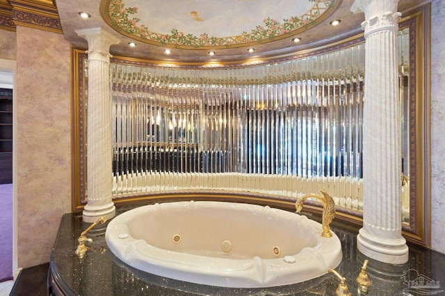 721 W Miracle Strip Pkwy, Mary Esther, FL 32569 - bathroom featuring decorative columns, a tub with jets, and ornamental molding