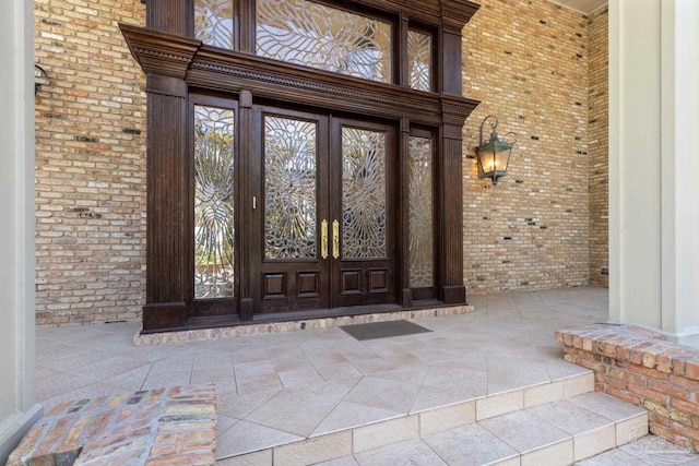 721 W Miracle Strip Pkwy, Mary Esther, FL 32569 - doorway to property featuring french doors and brick siding