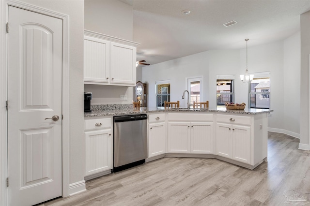 kitchen featuring visible vents, dishwasher, a peninsula, light wood-style floors, and a sink