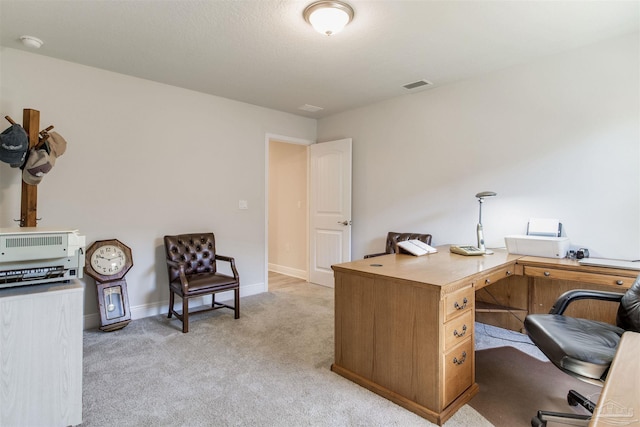 office with light colored carpet, visible vents, and baseboards