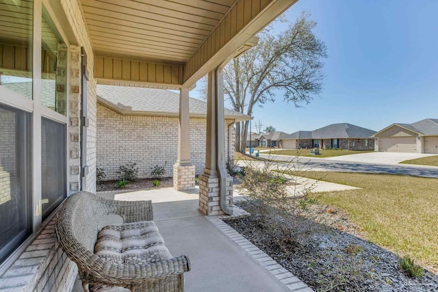 view of patio featuring a residential view and a porch