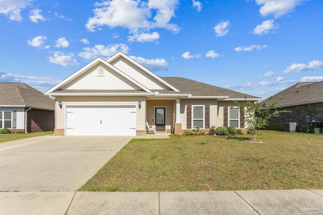 1664 Granite Ln, Cantonment, FL 32533 - view of front facade with a front yard, an attached garage, driveway, central AC, and board and batten siding