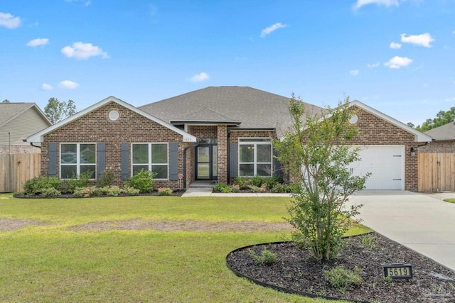 5619 Burr St, Milton, FL 32570 - ranch-style home featuring fence, an attached garage, a front lawn, brick siding, and concrete driveway