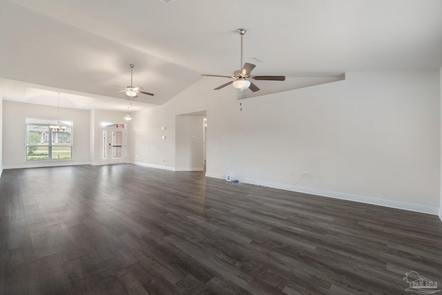 5619 Burr St, Milton, FL 32570 - unfurnished living room featuring vaulted ceiling, baseboards, ceiling fan with notable chandelier, and dark wood-type flooring