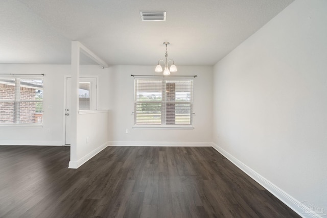 5619 Burr St, Milton, FL 32570 - unfurnished dining area with baseboards, dark wood-style flooring, a chandelier, and visible vents