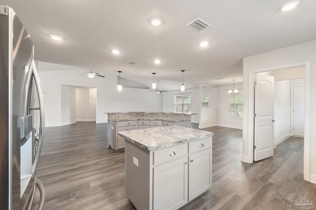 5619 Burr St, Milton, FL 32570 - kitchen featuring stainless steel refrigerator with ice dispenser, open floor plan, a ceiling fan, and a kitchen island