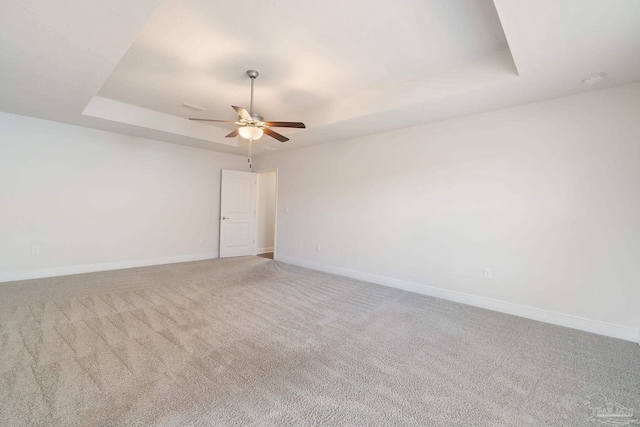 5619 Burr St, Milton, FL 32570 - carpeted spare room with baseboards, ceiling fan, and a tray ceiling