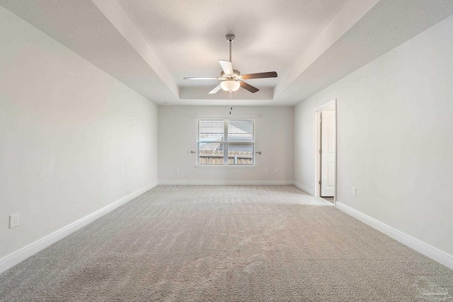 5619 Burr St, Milton, FL 32570 - unfurnished room with ceiling fan, light carpet, baseboards, and a raised ceiling