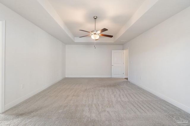 5619 Burr St, Milton, FL 32570 - unfurnished room featuring light colored carpet, baseboards, ceiling fan, and a tray ceiling