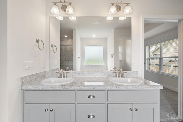 5619 Burr St, Milton, FL 32570 - bathroom featuring a sink, walk in shower, and double vanity