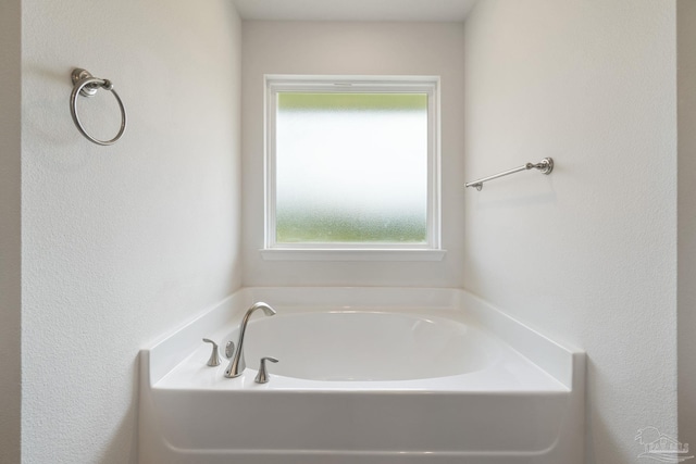 5619 Burr St, Milton, FL 32570 - bathroom with a textured wall and a bath