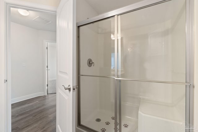 5619 Burr St, Milton, FL 32570 - full bathroom featuring baseboards, a shower stall, wood finished floors, and visible vents