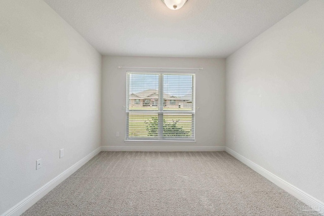 5619 Burr St, Milton, FL 32570 - empty room featuring baseboards and light colored carpet