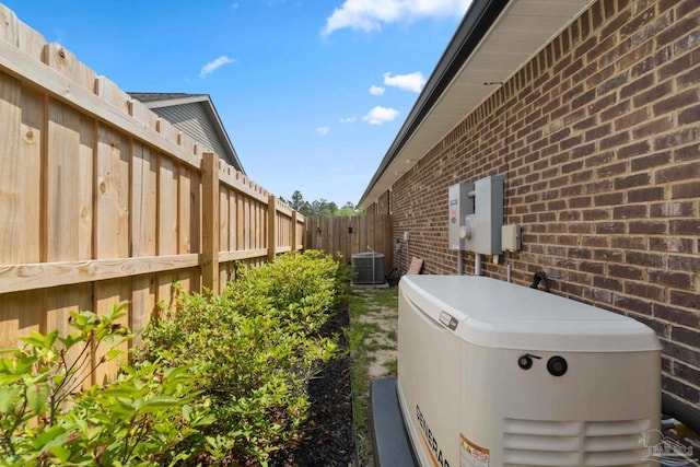 5619 Burr St, Milton, FL 32570 - exterior space with brick siding, cooling unit, and a fenced backyard