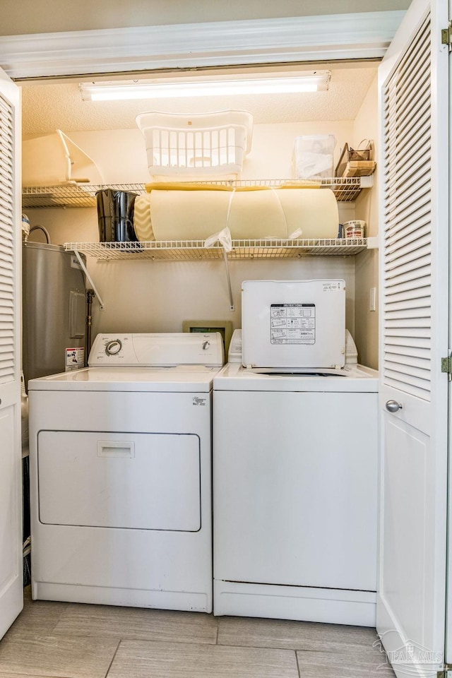 washroom with washer and clothes dryer