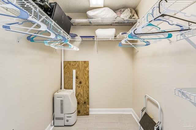 walk in closet featuring hardwood / wood-style floors