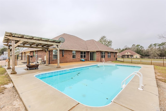 view of swimming pool featuring a fenced in pool, a patio, an outdoor fire pit, fence, and a pergola