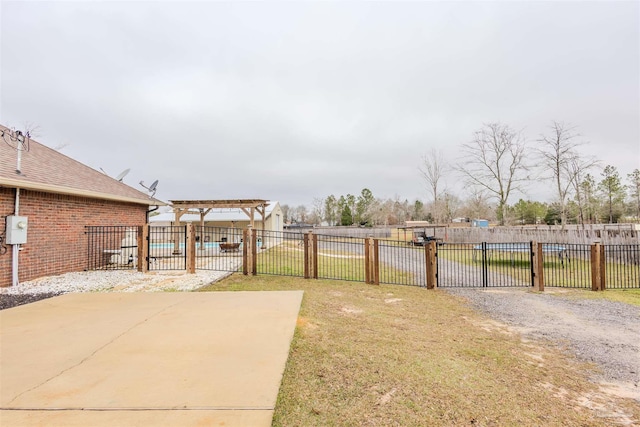 view of yard featuring fence, a community pool, and a pergola