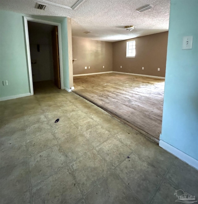 basement with a textured ceiling