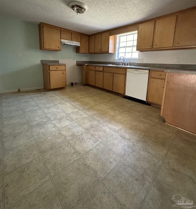 kitchen with a textured ceiling, dishwasher, and sink