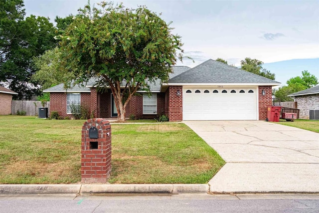 ranch-style house featuring driveway, a front yard, fence, and brick siding