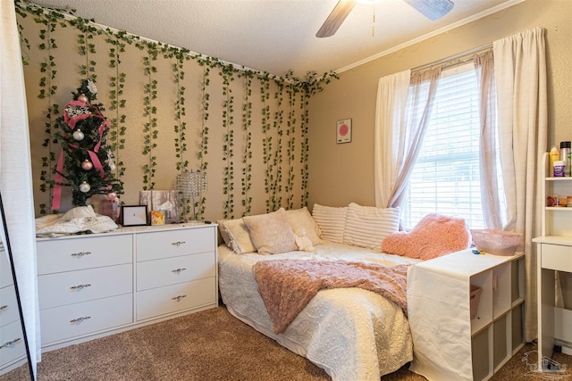 carpeted bedroom with ornamental molding and ceiling fan