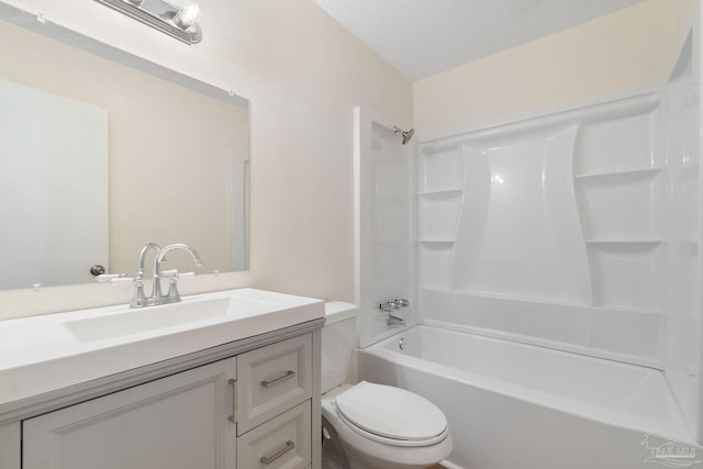 full bathroom with toilet, vanity, bathtub / shower combination, and a textured ceiling