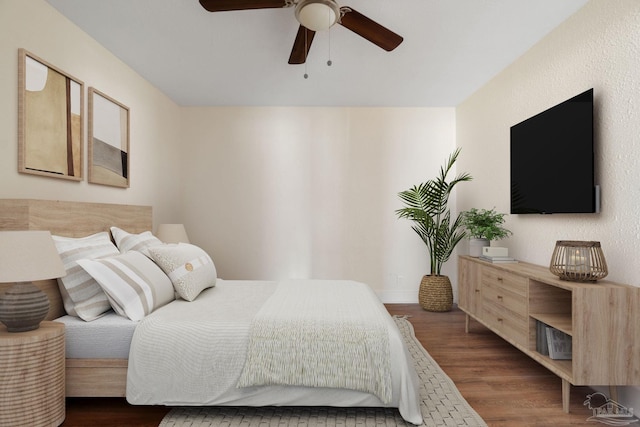 bedroom featuring ceiling fan and wood-type flooring