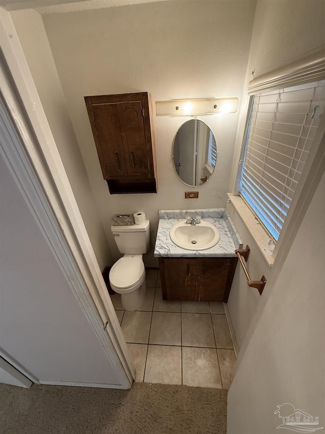 5402 Douglas St, Milton, FL 32570 - bathroom featuring vanity, toilet, and tile patterned floors