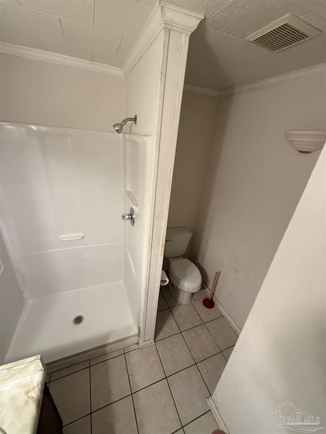 5402 Douglas St, Milton, FL 32570 - full bath with crown molding, toilet, tile patterned flooring, and a shower stall