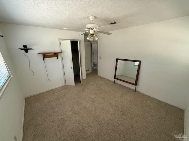 5402 Douglas St, Milton, FL 32570 - unfurnished bedroom with light carpet, a textured ceiling, and ceiling fan