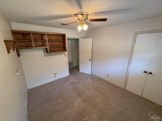 5402 Douglas St, Milton, FL 32570 - unfurnished bedroom with carpet floors, a textured ceiling, and ceiling fan